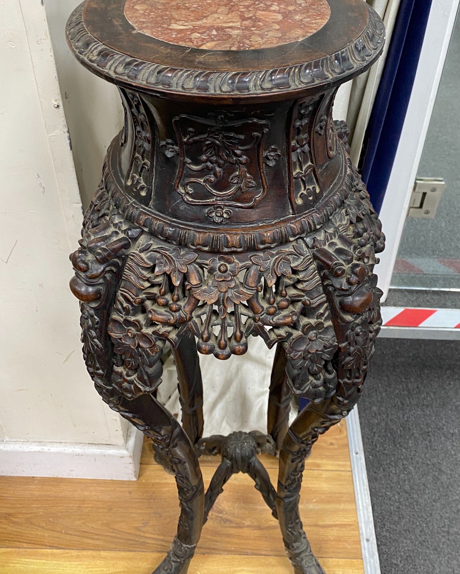 A Chinese carved hardwood marble topped vase stand, height 104cm